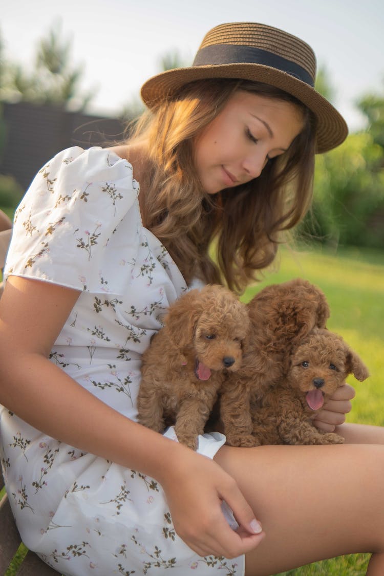 A Woman With Her Puppies 