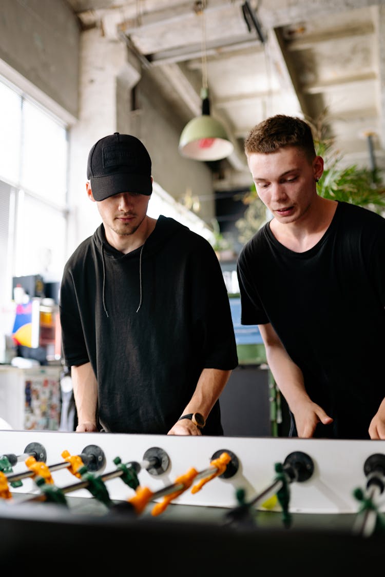 Men Playing Foosball