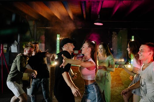 A Man and a Woman Dancing in a Night Club