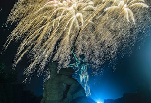 Fireworks above Statues