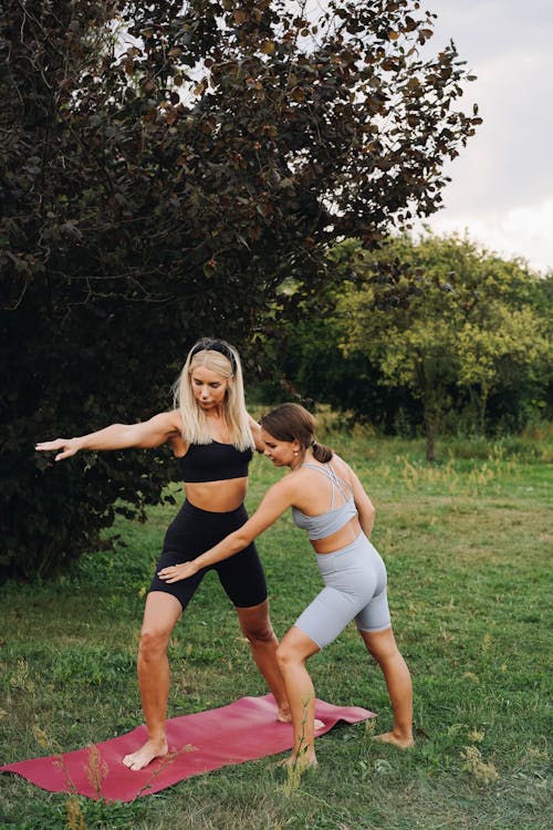 A Two Women Doing Workout Together 