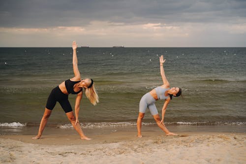 Women Exercising at the Beach