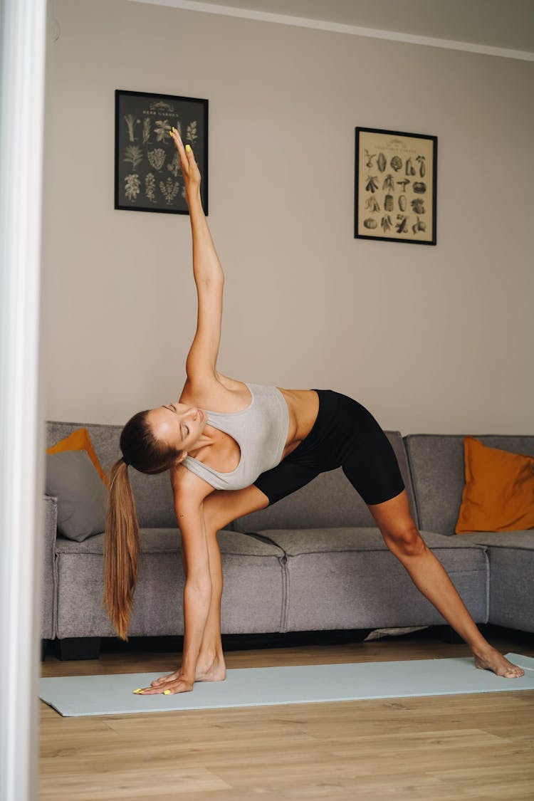 A Woman Doing The Triangle Pose 