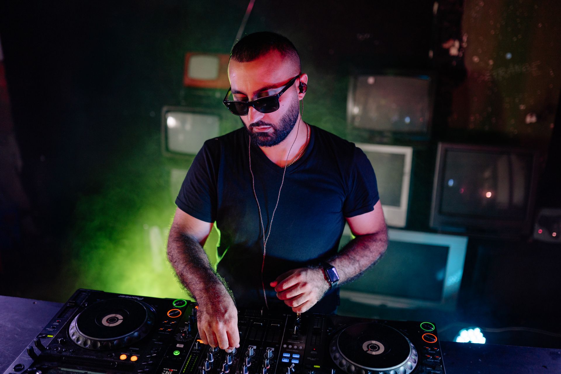 Man in Black T-shirt Wearing Black Sunglasses Playing Dj Controller