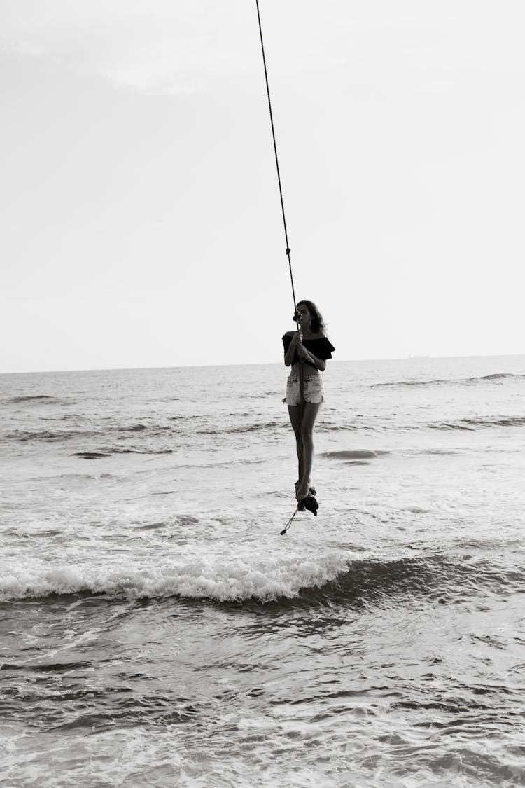A Woman On A Rope Doing Swing 