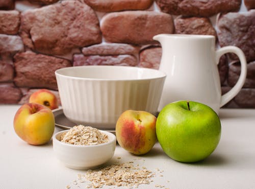Fresh Fruits and Oats on Ceramic Bowl