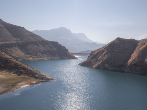 Free A breathtaking view of a serene lake surrounded by rugged mountains in Kabardino-Balkarian Republic, Russia. Stock Photo