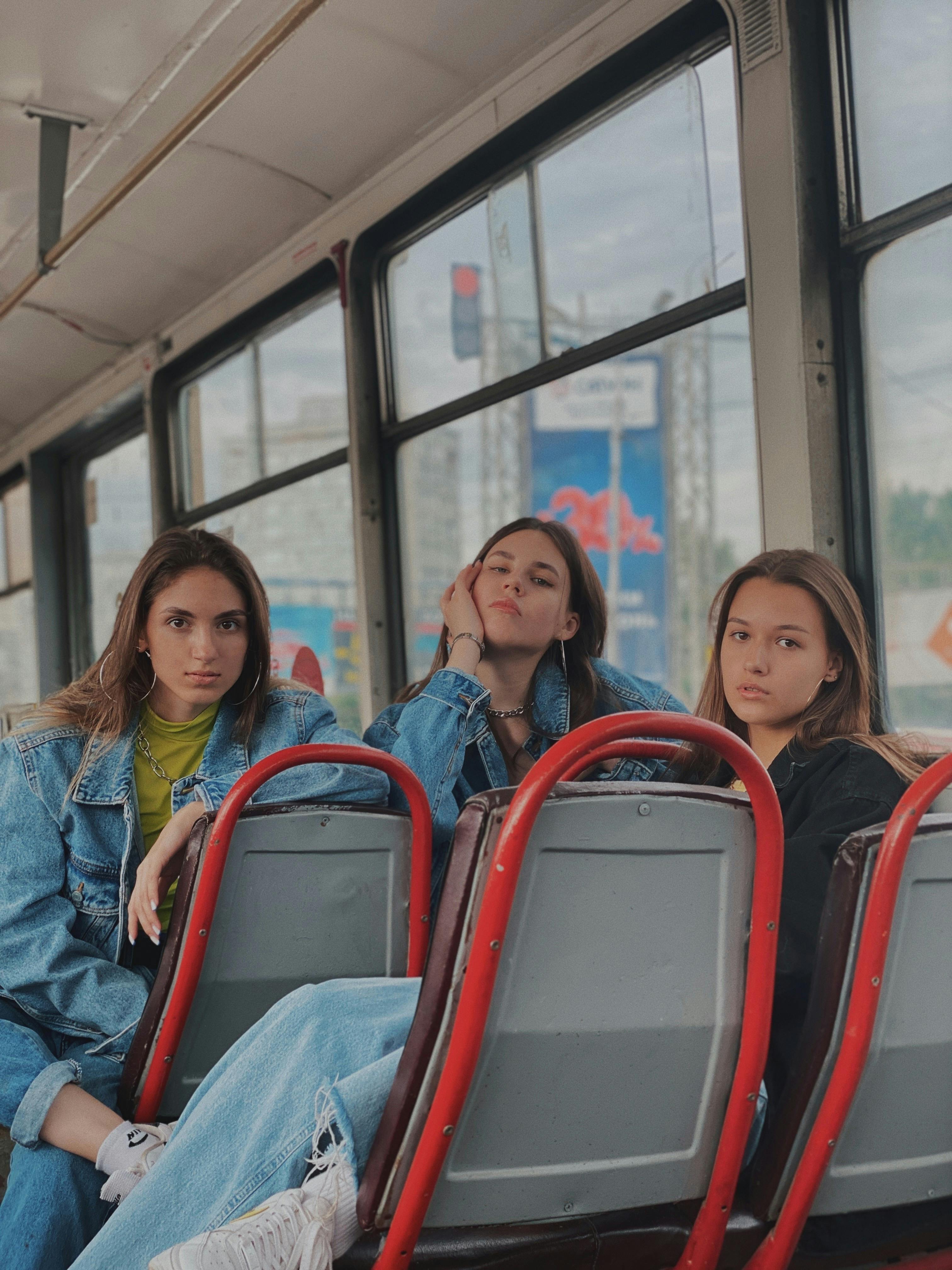 a group of women sitting inside the bus