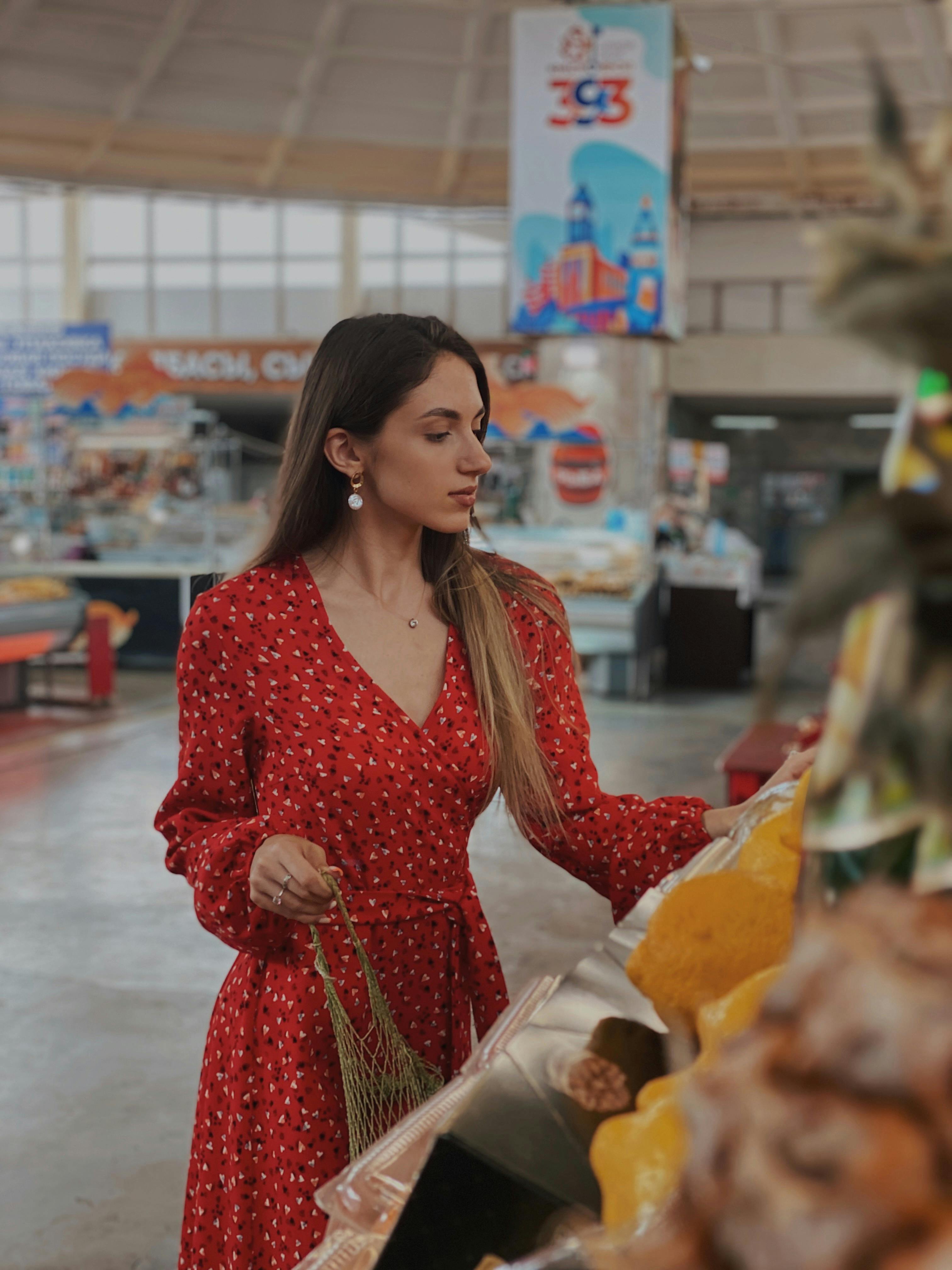 a woman in red dress shopping