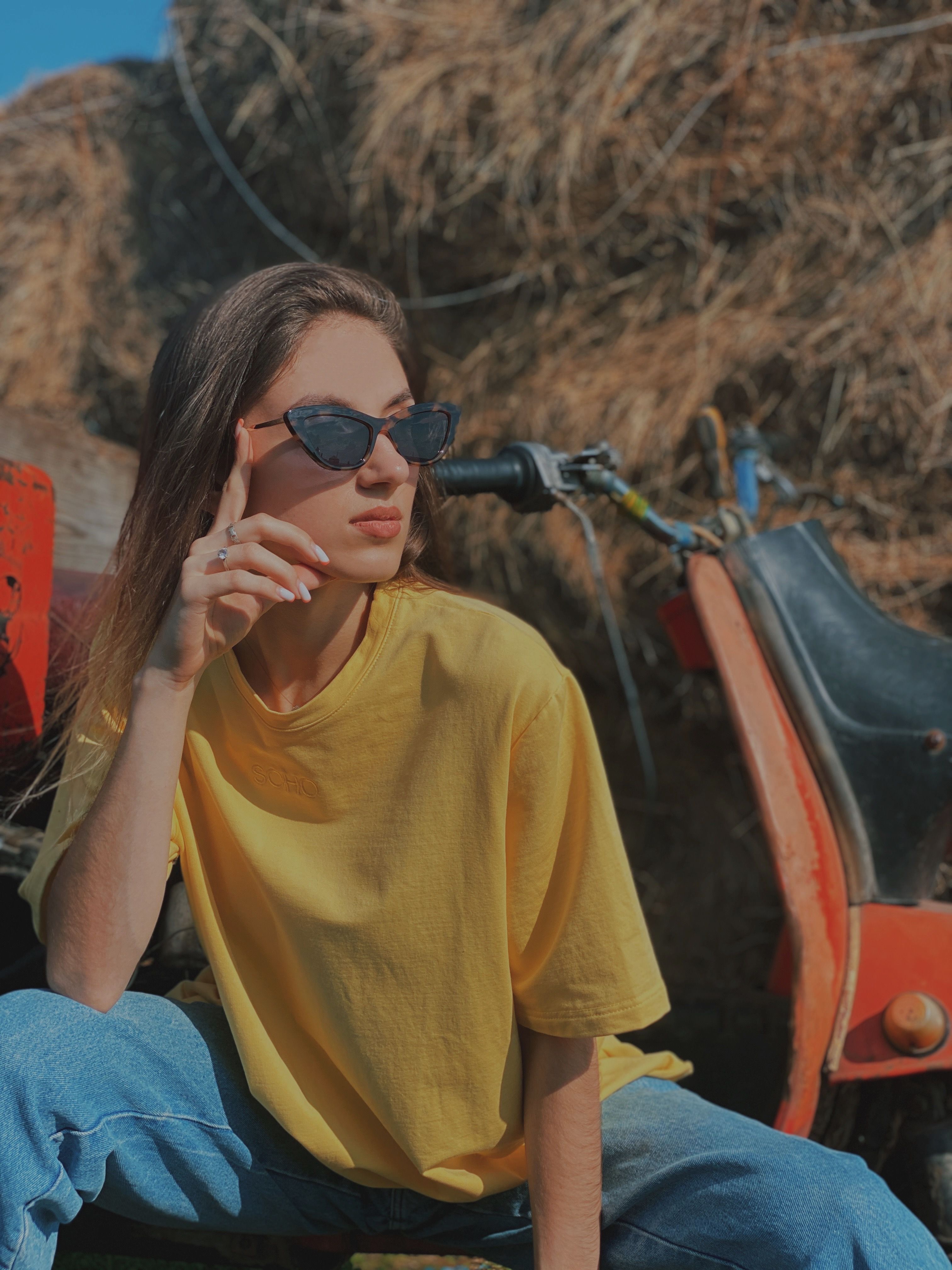 Woman in a Yellow Shirt Touching Her Sunglasses · Free Stock Photo