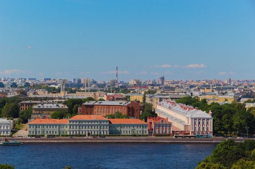 Free Aerial view of historic buildings along the Neva River in St. Petersburg, Russia with clear blue skies. Stock Photo