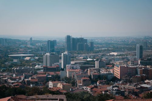Free Aerial view of Ankara showcasing modern skyscrapers and dense urban landscape under clear skies. Stock Photo