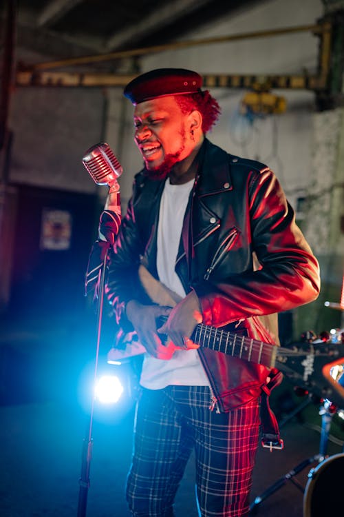 A Man in a Leather Jacket Singing