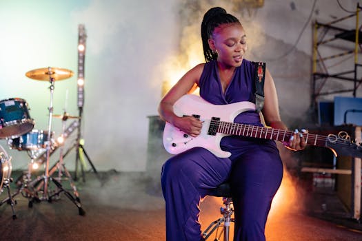 A female guitarist performs passionately on stage with lights and smoke effects.