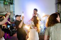 Man in Black Dancing with Woman in White on Party