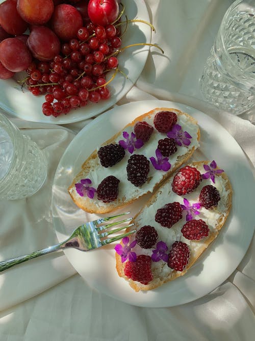 Free Raspberries Topping on Sliced Bread Stock Photo