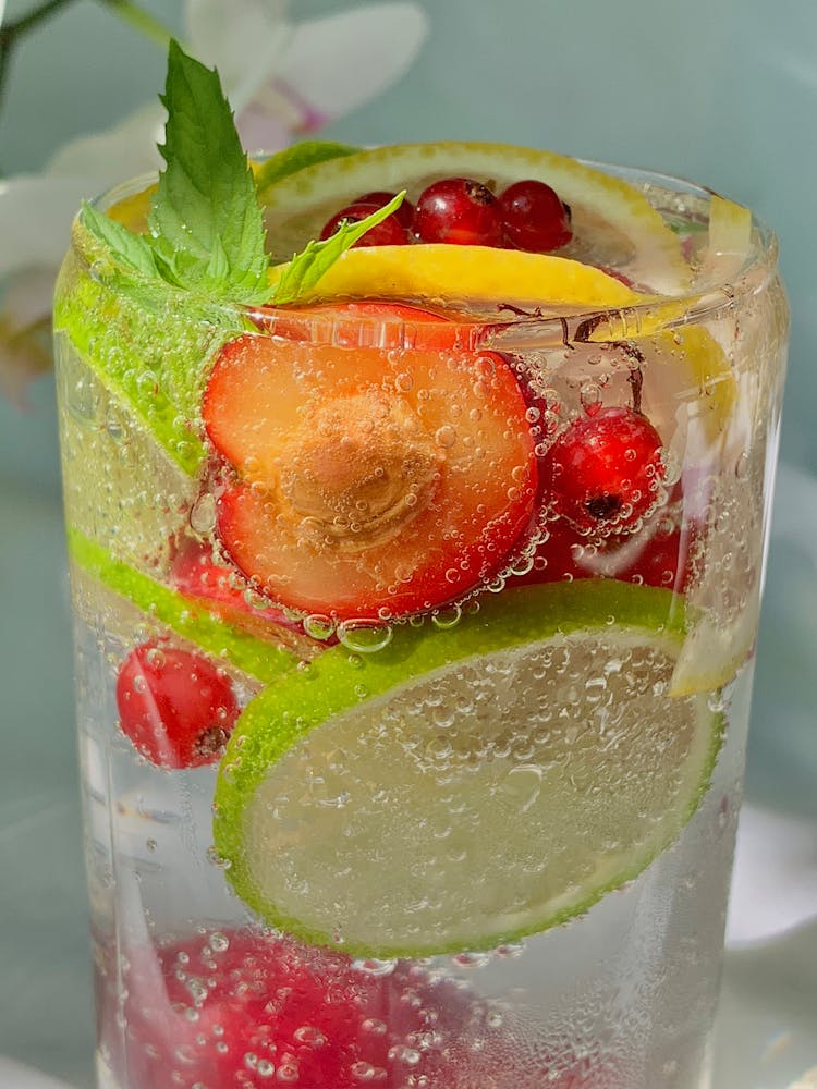 Carbonated Drink Full Of Fruits Slices