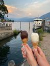 People Holding Ice Creams on Cones Near a River