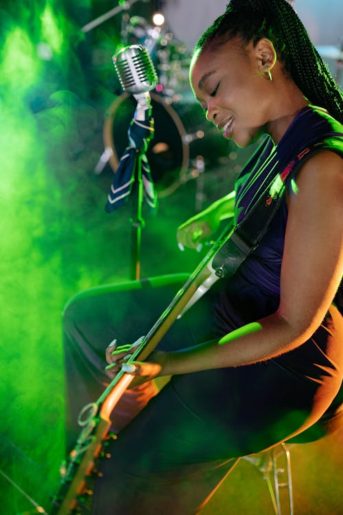 A Woman Playing a Guitar