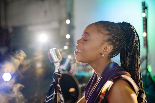 Close-up of an African American woman singing passionately with eyes closed.