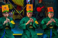 A Group of Men in Green Long Sleeve Uniform Playing Trumpets