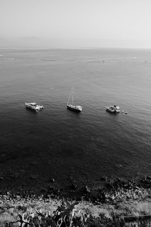 Monochrome Photograph of Boats on the Sea