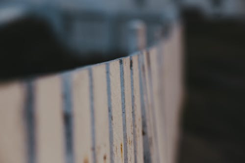 Selective Focus Photograph of a White Wooden Fence