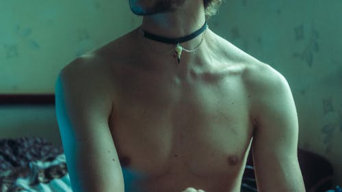 Free Topless Man Wearing Silver Necklace Stock Photo