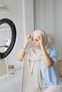 Woman in White Dress Covering Her Face With White Textile