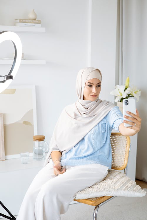 Free Woman Wearing Hijab Taking a Selfie Stock Photo