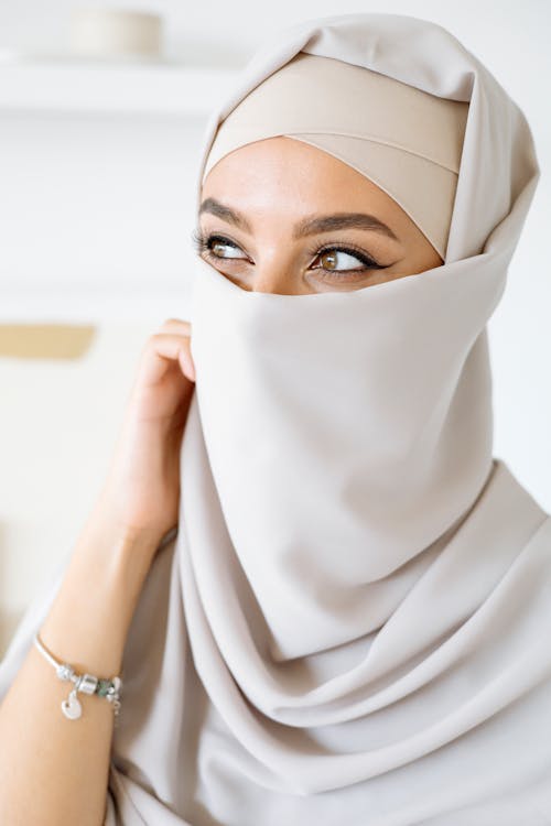 Woman in White Hijab Covering Her Face