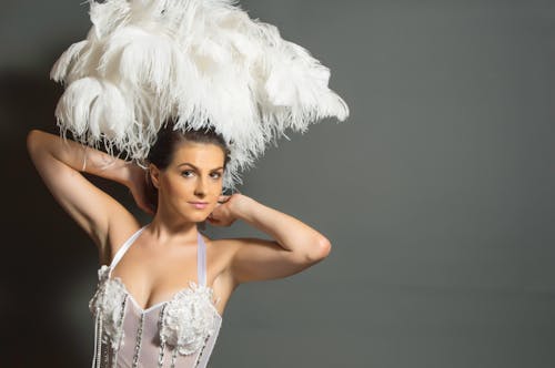 Woman in White Headdress and White Mesh Top