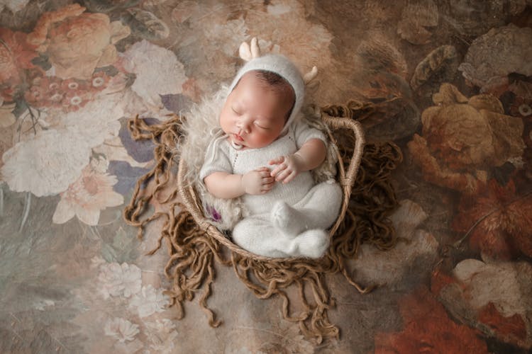 A Baby On A Basket