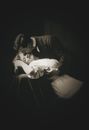 A Grayscale Photo of a Man Kissing Her Partner