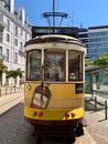Yellow and White Tram on Road