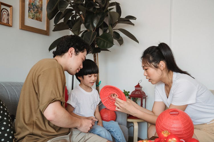 Family Making A Red Lantern 