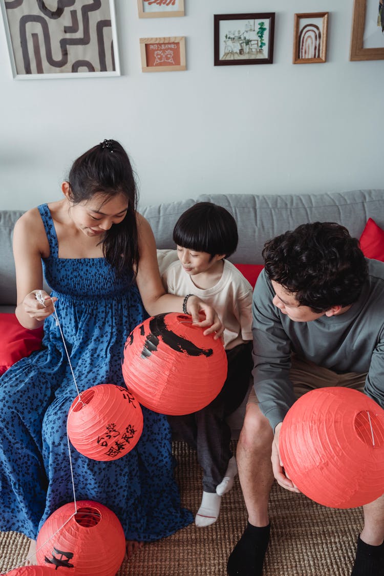 A Family Holding Chinese Lantern Decorations