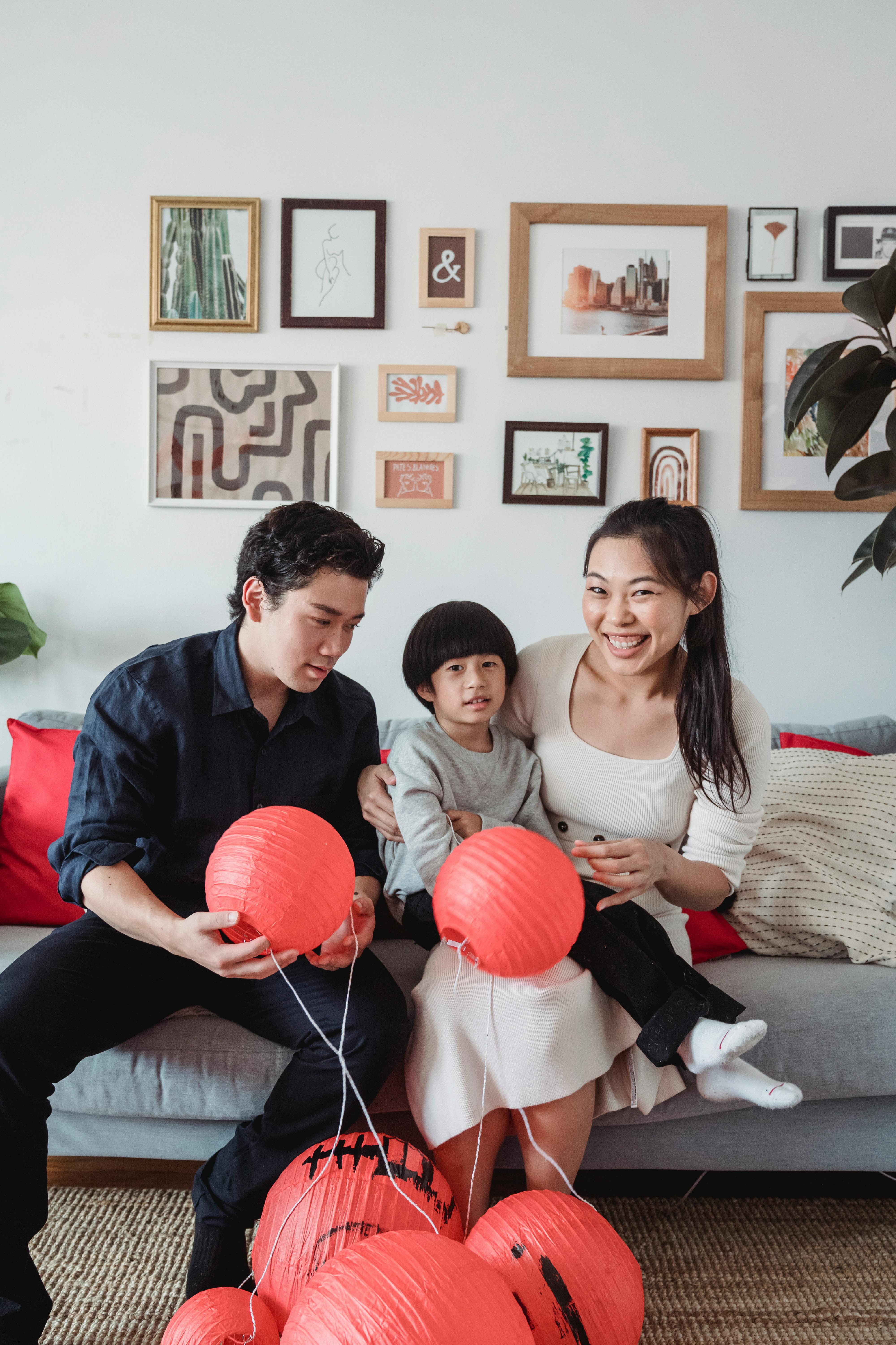 a family sitting on a couch