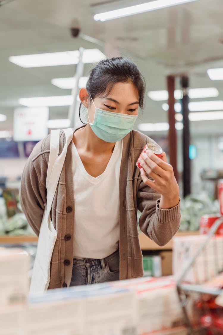 Woman Choosing Groceries While Shopping