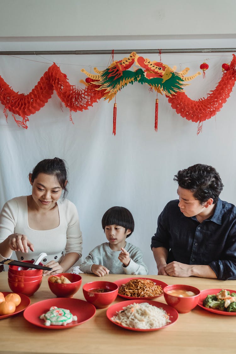 Family Sitting At The Table 