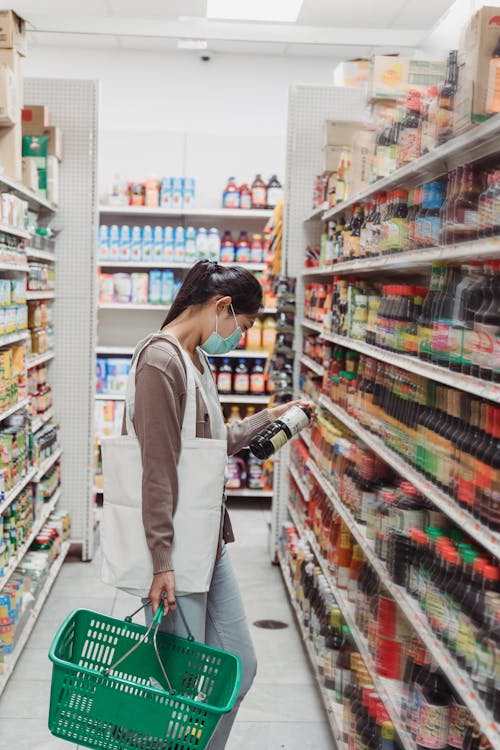 Free Woman Shopping Inside a Supermarket Stock Photo