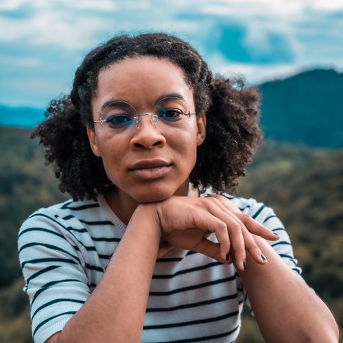 Free Woman in White and Black Striped Shirt Wearing Eyeglasses Stock Photo