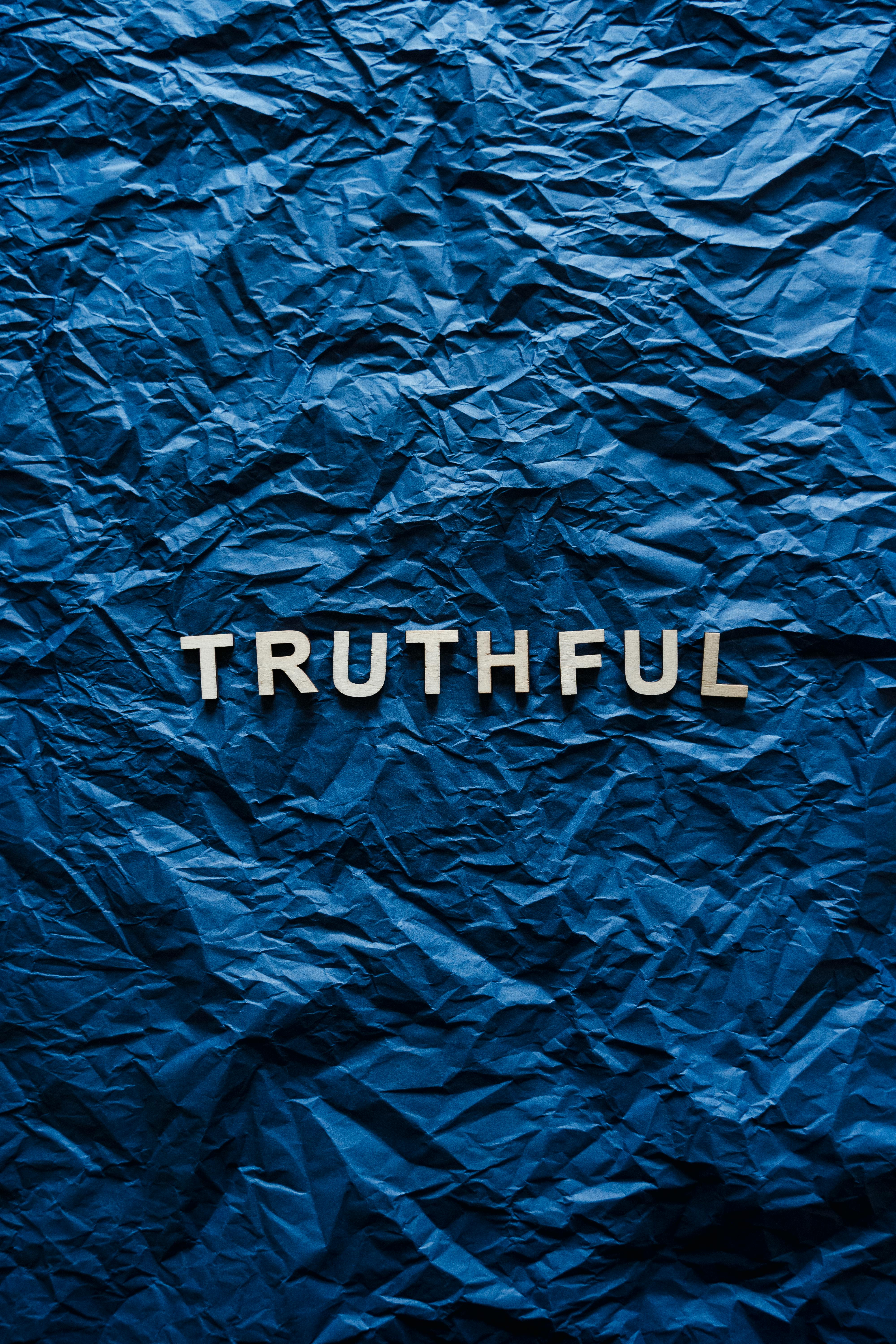 text on crumpled blue background