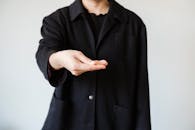A Person in Black Button Up Coat