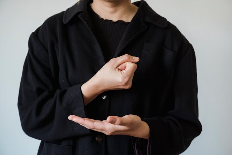 A Person Doing American Sign Language 