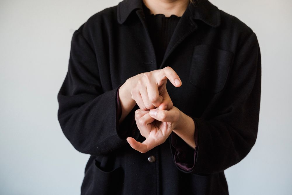 A person using Auslan sign language to communicate