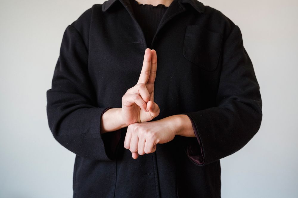 A person communicating using Auslan sign language