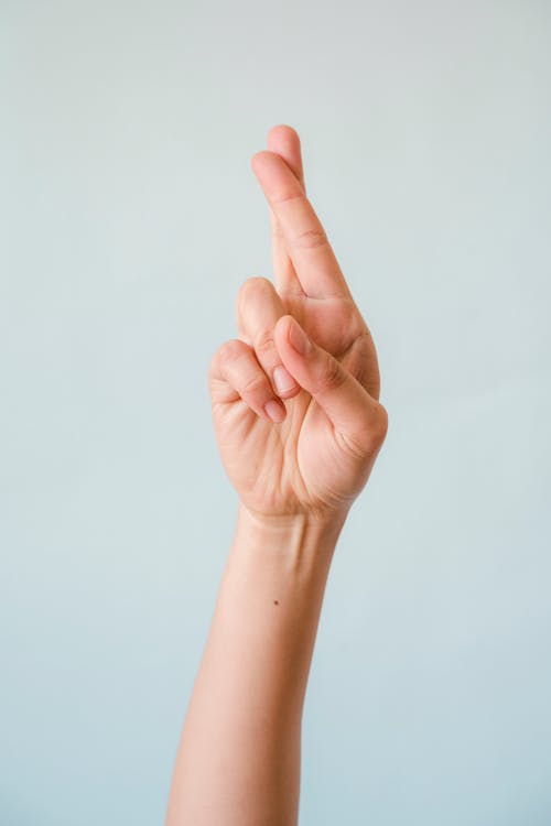 Free Person Doing Fingers Crossed Stock Photo