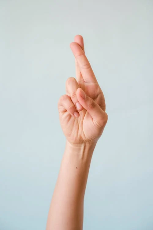 Free Person Doing Fingers Crossed Stock Photo