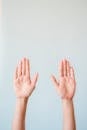 Persons Hand on White Surface